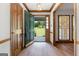 Bright foyer with wood floors, coat closet, and an open view to the front yard at 41 Ridgewood Cir, Mcdonough, GA 30252