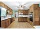 Functional kitchen with wood cabinets and adjacent breakfast area at 41 Ridgewood Cir, Mcdonough, GA 30252