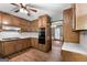 Fully equipped kitchen with wood cabinets and tile backsplash at 41 Ridgewood Cir, Mcdonough, GA 30252