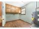 Laundry room with wooden cabinets, washer and dryer hookups, and wood look flooring at 41 Ridgewood Cir, Mcdonough, GA 30252