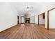 Open-concept living room with stone fireplace, vaulted ceiling, and wood-look flooring at 41 Ridgewood Cir, Mcdonough, GA 30252