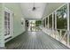 Spacious screened porch with ceiling fan, offering a comfortable outdoor living space and beautiful views at 41 Ridgewood Cir, Mcdonough, GA 30252