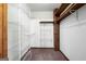 Walk-in closet with custom shelving and wood support beam at 41 Ridgewood Cir, Mcdonough, GA 30252