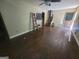 Spacious living room with hardwood floors, ceiling fan, and natural light at 4060 Sumit Wood Nw Dr, Kennesaw, GA 30152