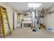 Unfinished basement with utility sink and ladder at 130 Allie Drive, Mcdonough, GA 30252