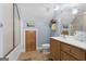 Charming bathroom featuring wood cabinets, tile floors, and tub-shower combination at 130 Allie Drive, Mcdonough, GA 30252