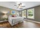 Inviting bedroom with hardwood flooring, natural light from two windows, and neutral decor at 130 Allie Drive, Mcdonough, GA 30252