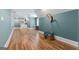 Spacious bonus room with hardwood floors, a neutral color scheme, built in shelving, and lots of natural light at 130 Allie Drive, Mcdonough, GA 30252