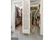 Walk-in closet featuring carpet, white shelving, and clothing racks for organized storage of clothing and shoes at 130 Allie Drive, Mcdonough, GA 30252
