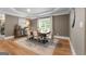 Elegant dining room with stylish furnishings, a decorative rug, and natural light at 130 Allie Drive, Mcdonough, GA 30252