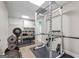 Home gym featuring professional weight lifting equipment and a doorway into a bathroom at 130 Allie Drive, Mcdonough, GA 30252