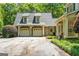 Spacious home featuring a three-car garage, with an inviting facade and well-manicured landscaping at 130 Allie Drive, Mcdonough, GA 30252