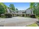Elegant exterior view of a home with a circular driveway and a well-manicured front yard at 130 Allie Drive, Mcdonough, GA 30252