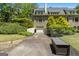 Back exterior view with brick and manicured yard at 130 Allie Drive, Mcdonough, GA 30252