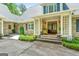 Inviting front porch with brick steps, double doors, and charming decor creating a welcoming entrance at 130 Allie Drive, Mcdonough, GA 30252