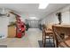 Spacious garage area features a workbench and overhead lighting and storage at 130 Allie Drive, Mcdonough, GA 30252
