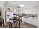 Charming kitchen with stainless steel appliances, hardwood flooring, and barstool seating at 130 Allie Drive, Mcdonough, GA 30252