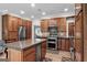 Beautiful kitchen with wood cabinetry, stainless appliances, and a large central island at 130 Allie Drive, Mcdonough, GA 30252