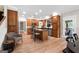 Spacious kitchen with wood cabinetry, granite counters, and a central island with seating at 130 Allie Drive, Mcdonough, GA 30252