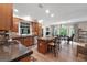 Kitchen extending into dining area with large central island and stainless steel appliances at 130 Allie Drive, Mcdonough, GA 30252