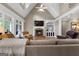 Bright living room with a fireplace, hardwood floors, built-in shelves, and comfortable seating, creating an inviting space at 130 Allie Drive, Mcdonough, GA 30252