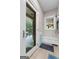 Mud room with a pet door, bench, and exterior door leading to the outside at 130 Allie Drive, Mcdonough, GA 30252
