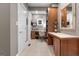Mud room featuring a desk, built-in shelving, a small window, and a view to an adjoining room at 130 Allie Drive, Mcdonough, GA 30252