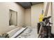 Storage room with a mirror, ideal for organizing golf clubs or other recreational equipment at 130 Allie Drive, Mcdonough, GA 30252