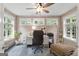 Cozy study with natural light from three windows and wood paneled walls at 130 Allie Drive, Mcdonough, GA 30252