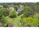 Expansive backyard featuring a lush lawn, mature trees, and a sparkling pool, creating a serene outdoor oasis at 405 Highgrove Dr, Fayetteville, GA 30215