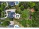 A stunning aerial view of a private backyard oasis with a custom pool, patio, and beautifully landscaped grounds at 405 Highgrove Dr, Fayetteville, GA 30215