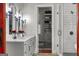 Modern bathroom with double vanity, marble countertops, subway tile shower, and herringbone-patterned floors at 405 Highgrove Dr, Fayetteville, GA 30215