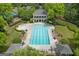 Aerial view of a community clubhouse and large pool with lounge chairs, offering a perfect place to relax at 405 Highgrove Dr, Fayetteville, GA 30215
