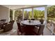 Covered porch with outdoor seating for six, perfect for al fresco dining and relaxation at 405 Highgrove Dr, Fayetteville, GA 30215