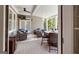 Outdoor covered porch with a ceiling fan, plenty of seating, and a mounted television at 405 Highgrove Dr, Fayetteville, GA 30215