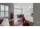 Open-concept dining area with a breakfast bar, a dining table, and plenty of natural light at 405 Highgrove Dr, Fayetteville, GA 30215