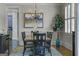 Elegant dining room featuring a stylish chandelier and ample seating at 405 Highgrove Dr, Fayetteville, GA 30215