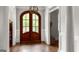 Inviting foyer showcasing hardwood floors and an elegant arched doorway at 405 Highgrove Dr, Fayetteville, GA 30215