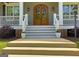 Elegant front entrance featuring a beautiful arched double door and decorative sidelights at 405 Highgrove Dr, Fayetteville, GA 30215