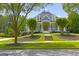Stunning home featuring a manicured lawn, charming front porch, and lush landscaping at 405 Highgrove Dr, Fayetteville, GA 30215