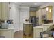 Well-appointed kitchen featuring granite countertops, stainless steel appliances, and custom cabinets at 405 Highgrove Dr, Fayetteville, GA 30215