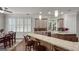 Kitchen with stone countertops, custom cabinets, stainless steel appliances, and a breakfast bar at 405 Highgrove Dr, Fayetteville, GA 30215