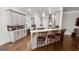 Bright kitchen featuring granite countertops, custom cabinets, and a breakfast bar with seating at 405 Highgrove Dr, Fayetteville, GA 30215