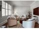 Comfortable living room featuring neutral colors, plush seating, and natural lighting at 405 Highgrove Dr, Fayetteville, GA 30215