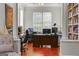 Dedicated home office featuring hardwood floors, built-in shelving, and plenty of natural light at 405 Highgrove Dr, Fayetteville, GA 30215