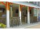 A modern outdoor kitchen featuring barstool seating, stone accents, stainless steel storage and TV's at 405 Highgrove Dr, Fayetteville, GA 30215