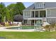 Relaxing backyard pool area surrounded by lush green grass and outdoor seating, perfect for entertaining at 405 Highgrove Dr, Fayetteville, GA 30215