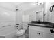 Updated bathroom with a tub shower, vanity with granite countertop, and a large mirror offering comfort and style at 1404 Meadowind Court Sw, Conyers, GA 30094