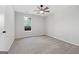 Cozy bedroom showcasing a window, carpet, and ceiling fan at 1404 Meadowind Court Sw, Conyers, GA 30094