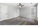 Bedroom showcasing gray walls, neutral carpeting, and a ceiling fan at 1404 Meadowind Court Sw, Conyers, GA 30094